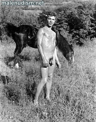nude boy outdoors with a horse