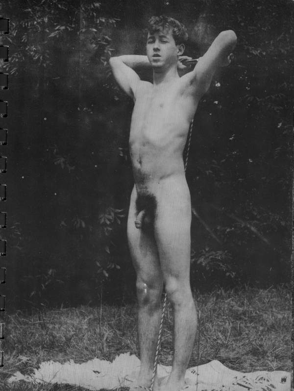 naked man posing outdoors